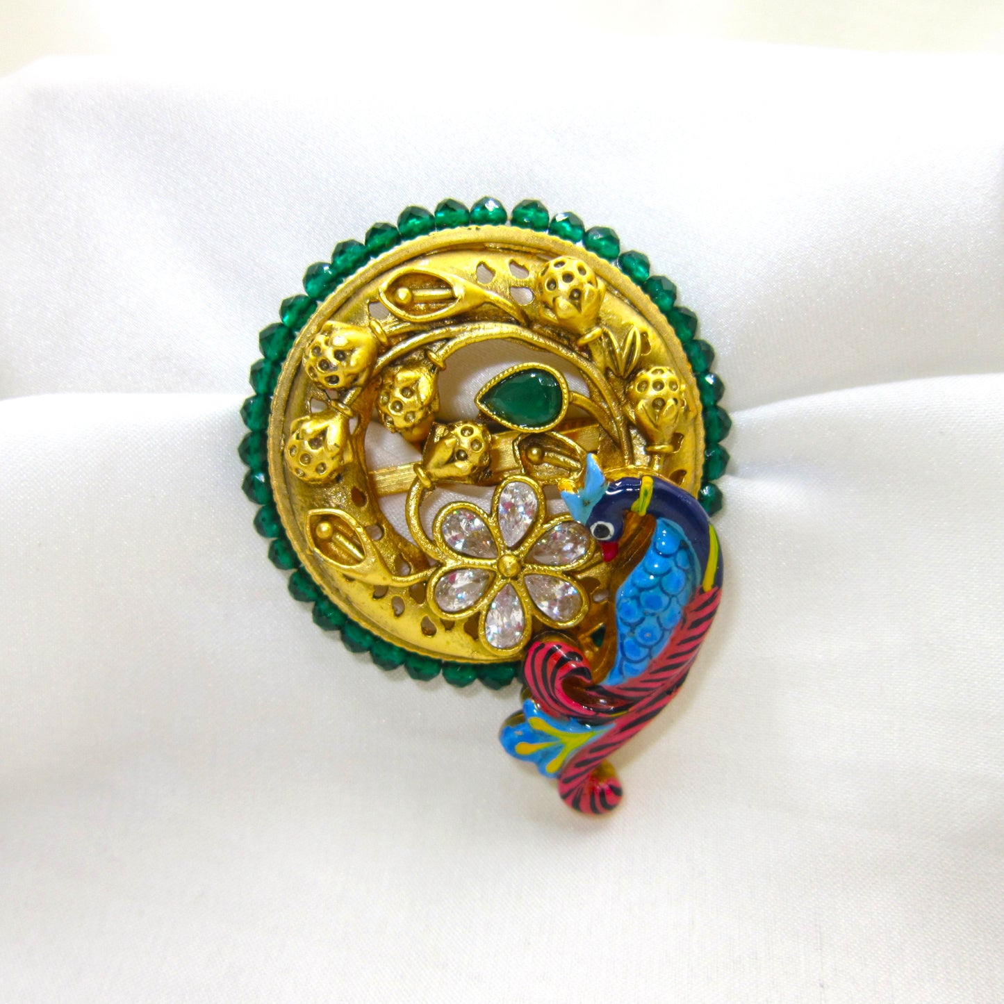Mayurika Heritage Peacock Antique Golden Finish Ring by Enava featuring a handcrafted peacock motif, floral stone design, emerald green detailing, adjustable statement ethnic ring in antique gold finish for weddings, festive and traditional wear.
