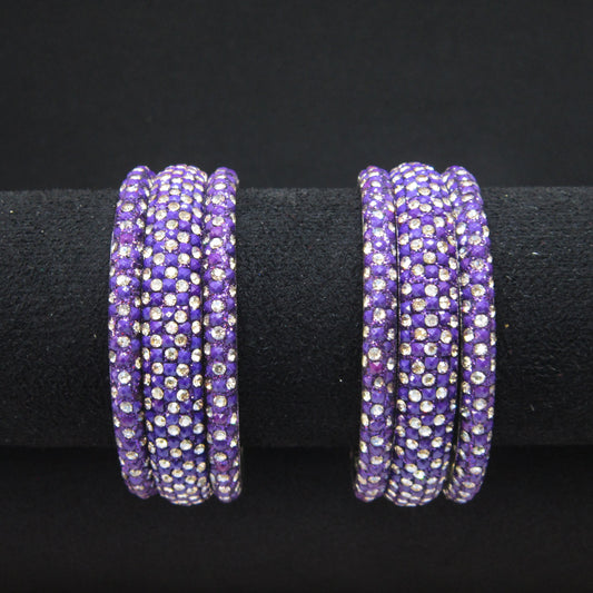 Meher Dark Purple Festive Bangle Set with 2 kada bangles and 4 side bangles featuring dark purple detailing, golden accents and sparkling stones by ENAVA