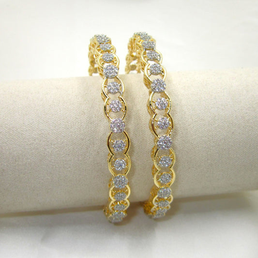 Orbit Gold Plated CZ AD Bangles by ENAVA with sparkling white Cubic Zirconia American Diamonds, premium gold plated designer AD bangles featuring an elegant orbit pattern, perfect for bridal wear, weddings, festive occasions, party wear jewellery, and ethnic fashion.