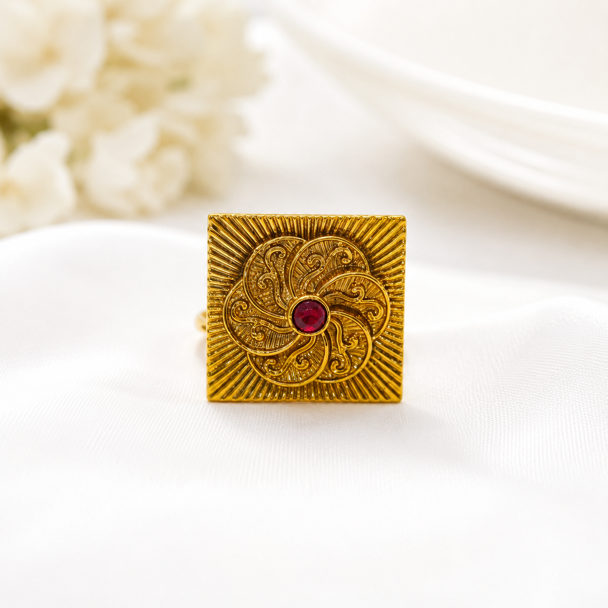 Ruby Sunburst Antique Square Ring by Enava featuring a handcrafted square sunburst design with a ruby red glass stone, antique golden finish, adjustable statement ring for festive wear, weddings, ethnic fashion, traditional Indian jewellery, and heritage-inspired styling.
