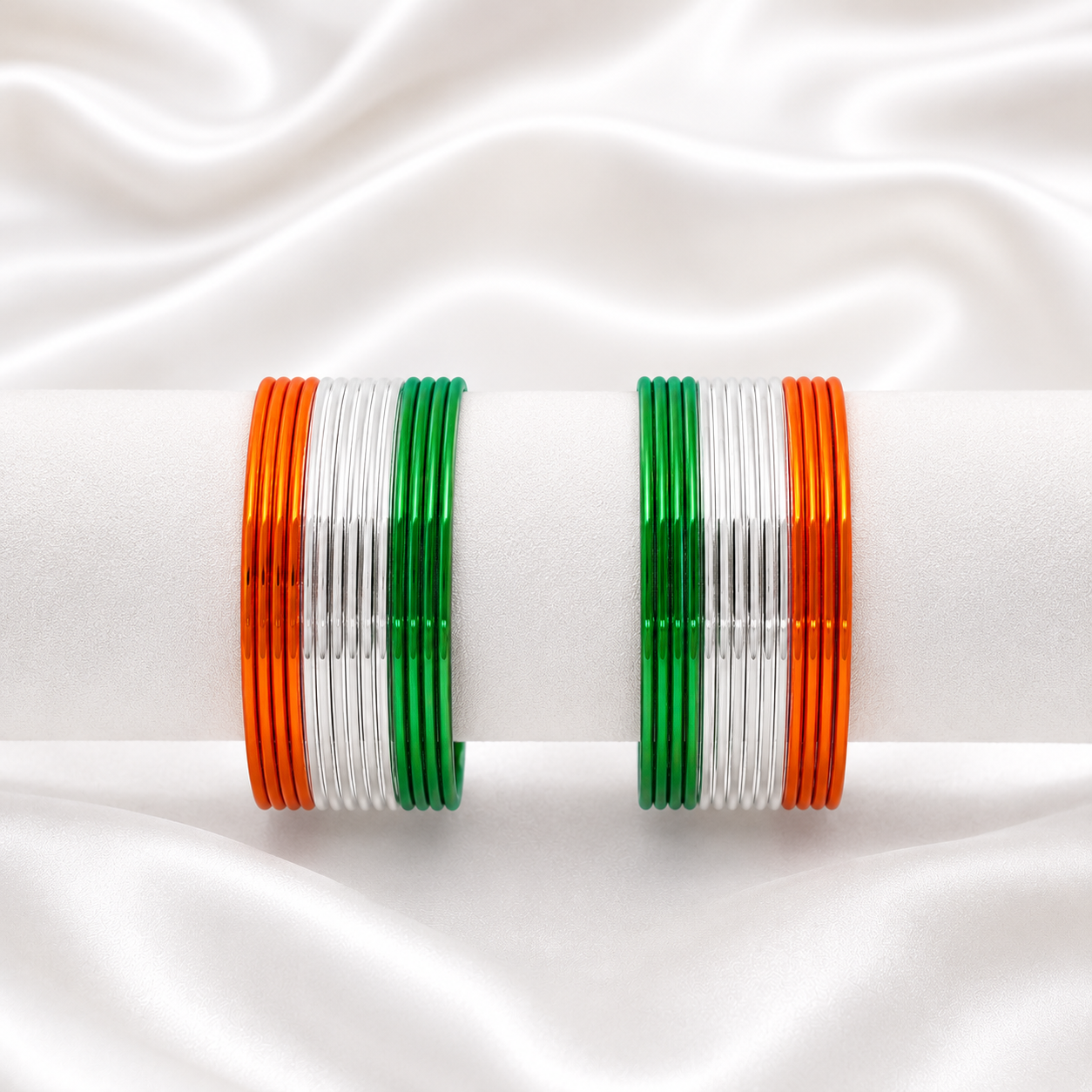 Saffron Trio Glossy Metal Bangles by Enava featuring a premium set of 24 glossy aluminium bangles in saffron, white and green tricolour finish, lightweight waterproof bangles ideal for Independence Day celebrations, patriotic events, festive occasions and ethnic wear.