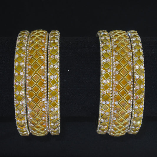 Sitara Yellow Festive Bangle Set with 2 kada bangles and 4 side bangles featuring yellow detailing, golden latticework and sparkling stones by ENAVA