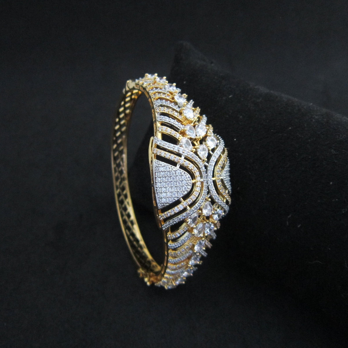 Solara AD Golden Bracelet with broad two-tone gold and silver finish, intricate sparkling American Diamond AD stones and designer detailing by ENAVA.