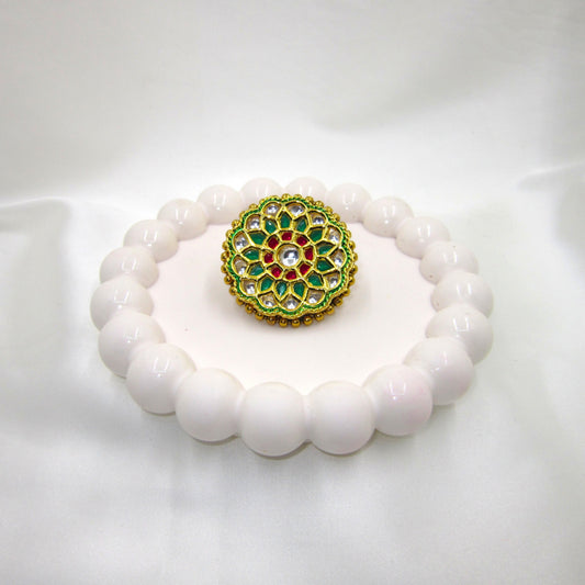 Vrinda Ethnic & Traditional Kundan Ring by Enava featuring white kundan stones, green enamel petals, ruby-pink accents, and gold plating in a floral statement design for ethnic, festive, and wedding wear.