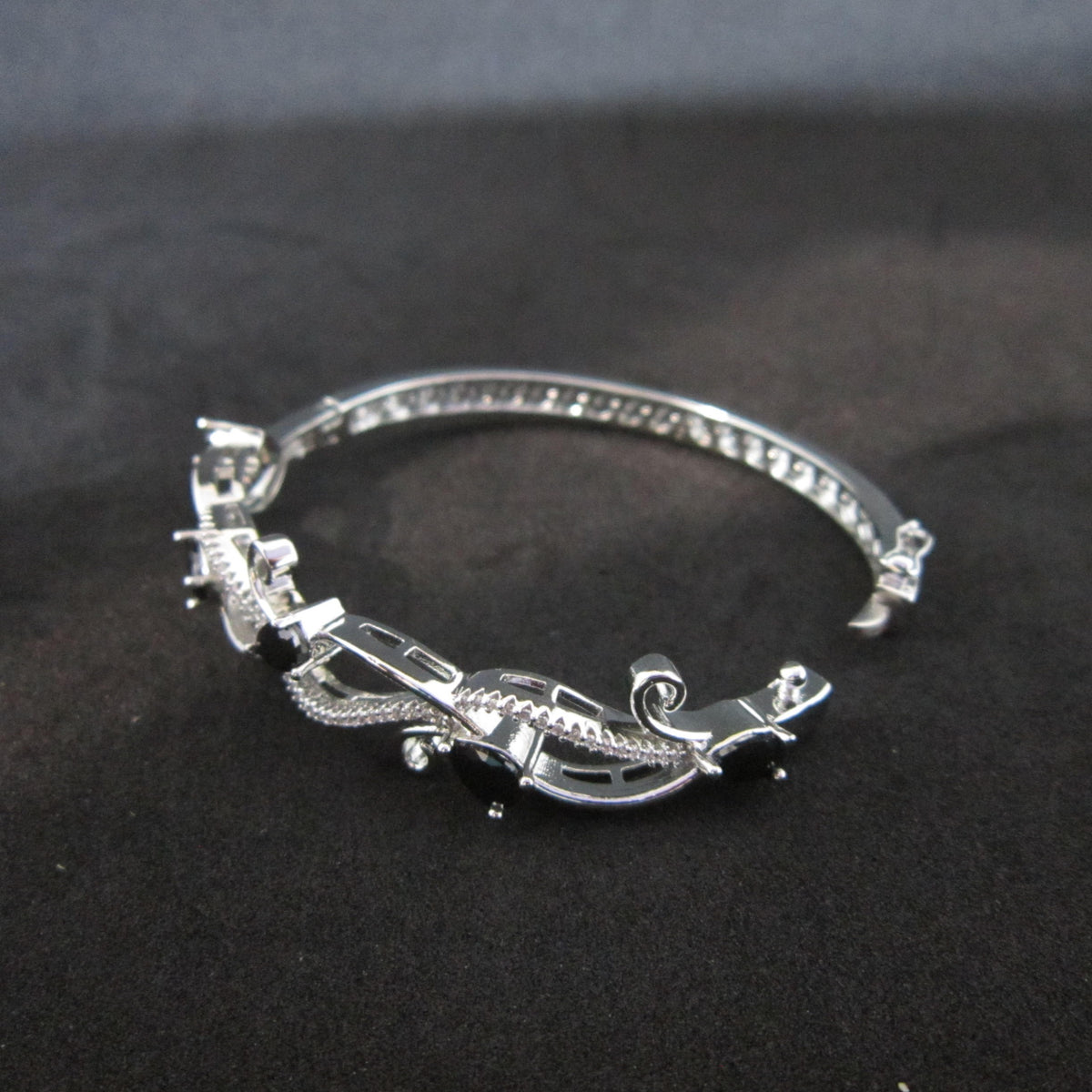 Blackvelle AD Bracelet with large black American Diamond stones in creeper-inspired designer pattern, premium black stone bracelet for women by ENAVA.