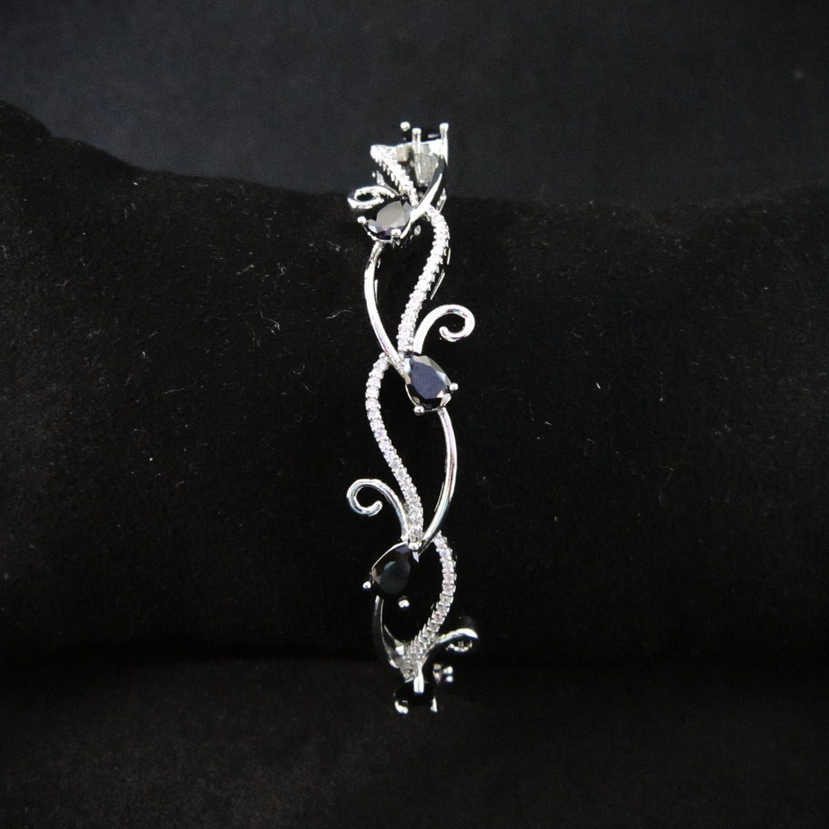 Blackvelle AD Bracelet with large black American Diamond stones in creeper-inspired designer pattern, premium black stone bracelet for women by ENAVA.
