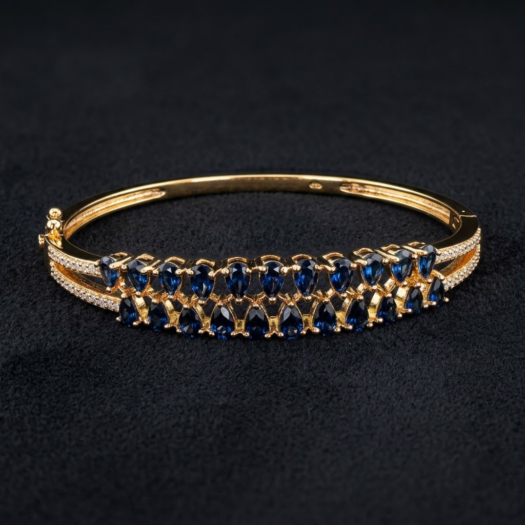 Blue Stones AD Bracelet with a series of deep blue American Diamond stones, sparkling AD detailing and gold-tone finish, elegant designer bracelet for women by ENAVA.