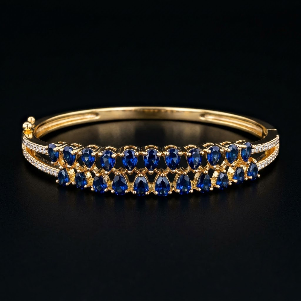 Blue Stones AD Bracelet with a series of deep blue American Diamond stones, sparkling AD detailing and gold-tone finish, elegant designer bracelet for women by ENAVA.
