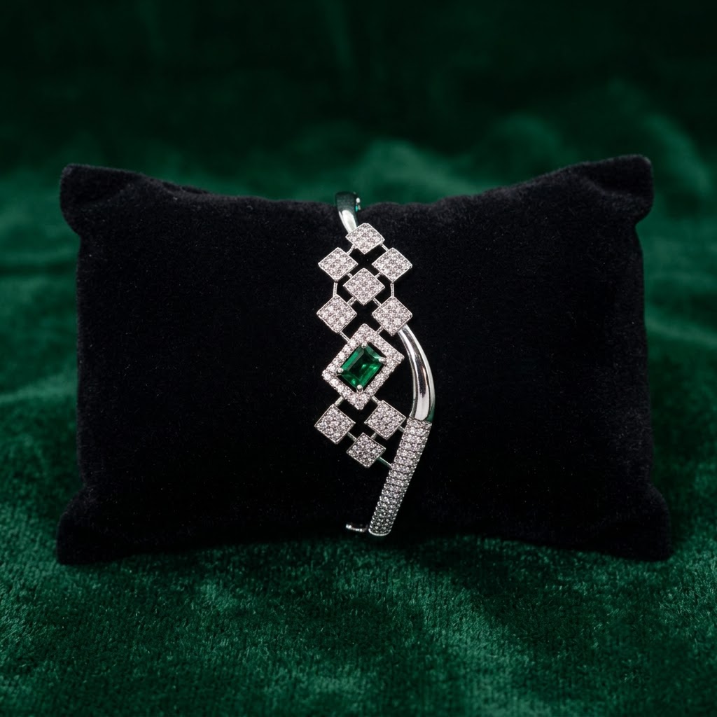 Cubix Royal Green Emerald Bracelet with complete American Diamond square pattern design and green emerald center stone, elegant geometric designer bracelet for women by ENAVA.