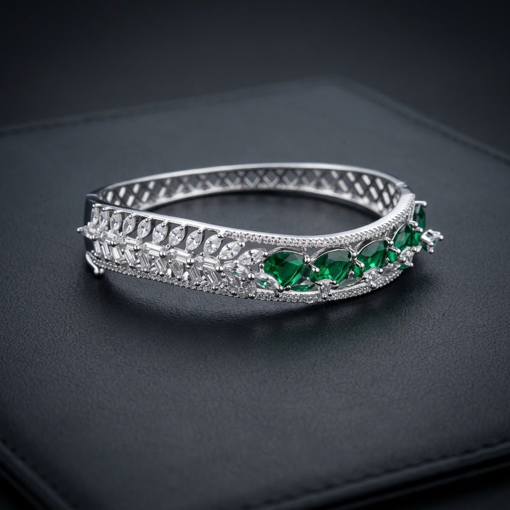Emerald Dreams Sparkling AD Bracelet with wavy curve design, sparkling American Diamond stones and emerald green stone motifs, elegant designer bracelet for women by ENAVA.