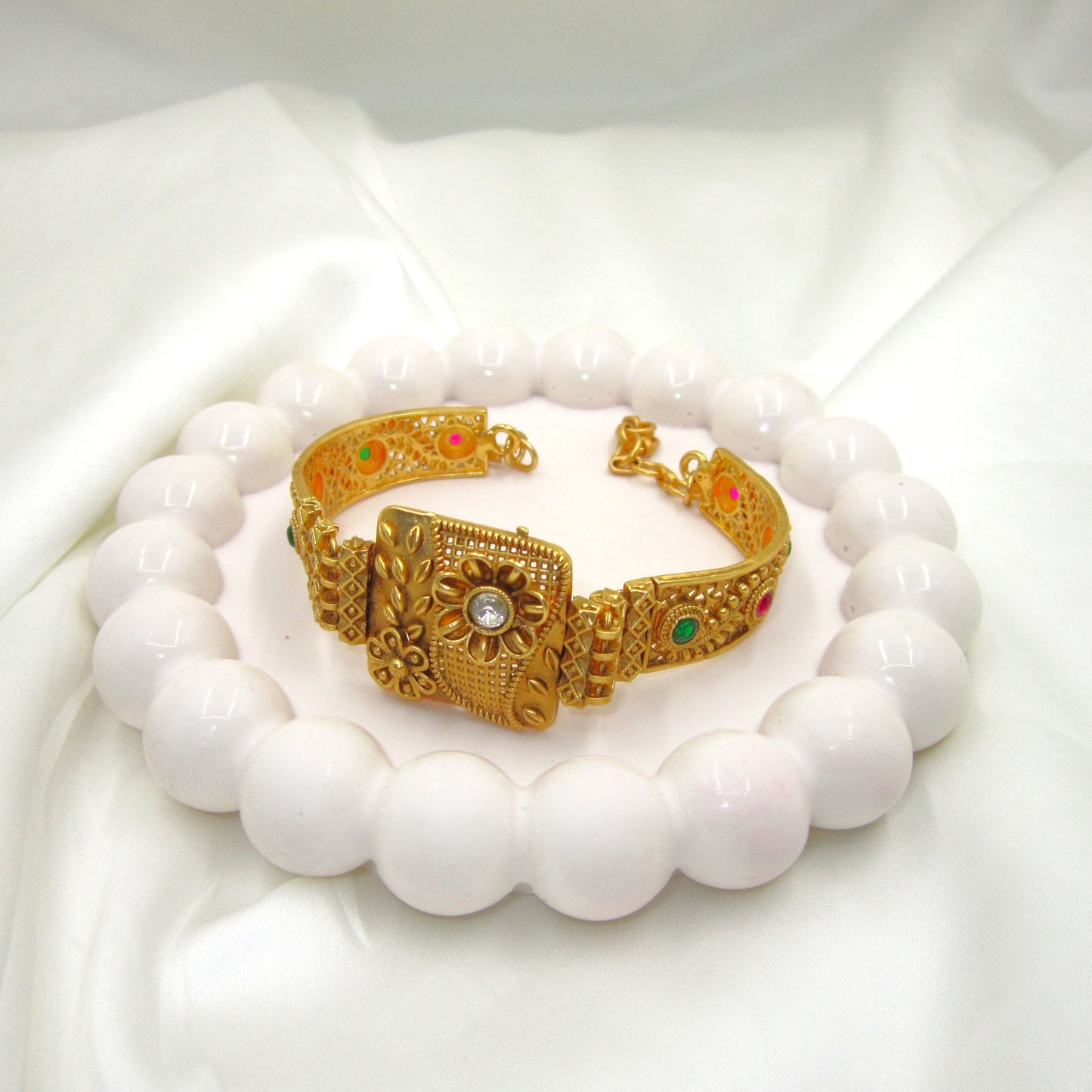 Floral Petals Ethnic & Traditional Rajwadi Antique Bracelet by ENAVA featuring intricate floral motifs, antique gold finish, colourful stone accents, and traditional Rajwadi craftsmanship, elegant ethnic bracelet for weddings, festivals, Mehendi, Haldi, and special occasions.