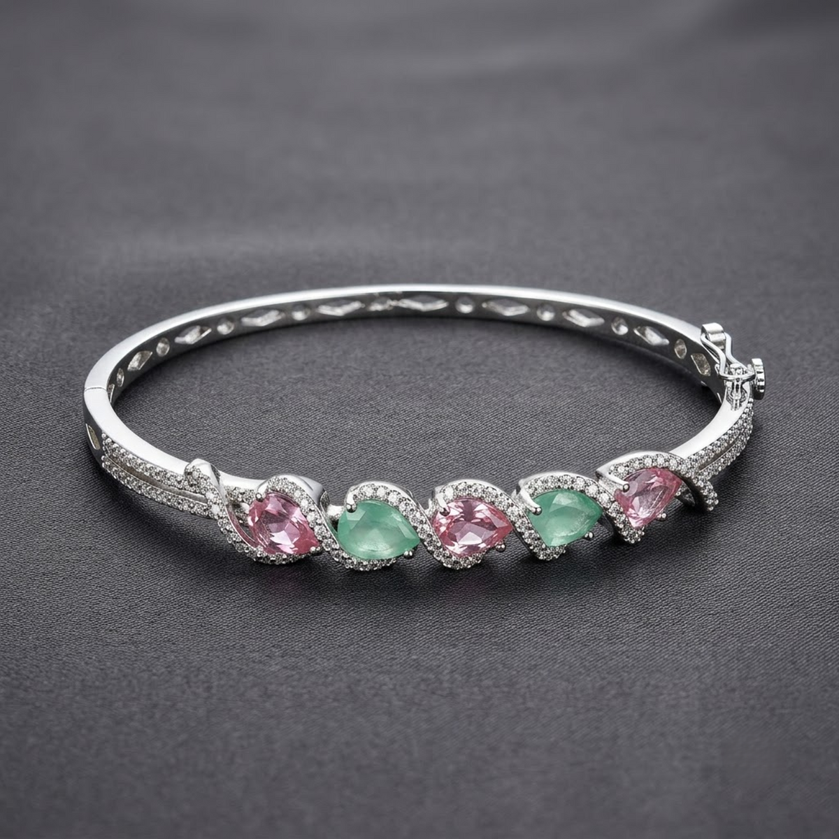 Gemelle Pink & Oceanic Blue Bracelet with light pink and oceanic blue-green AD stones, silver-tone designer bracelet for women by ENAVA.