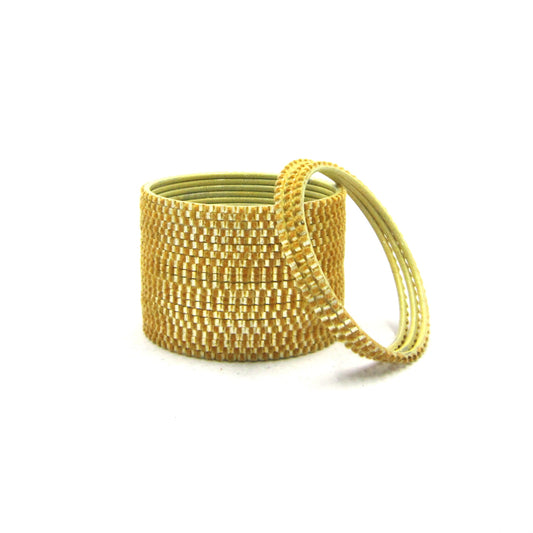 Glam Golden Metal 24 Bangles by ENAVA featuring a luxurious velvet and glossy finish. Premium plain designer metal bangles for women, ideal for weddings, festive occasions, and everyday wear.