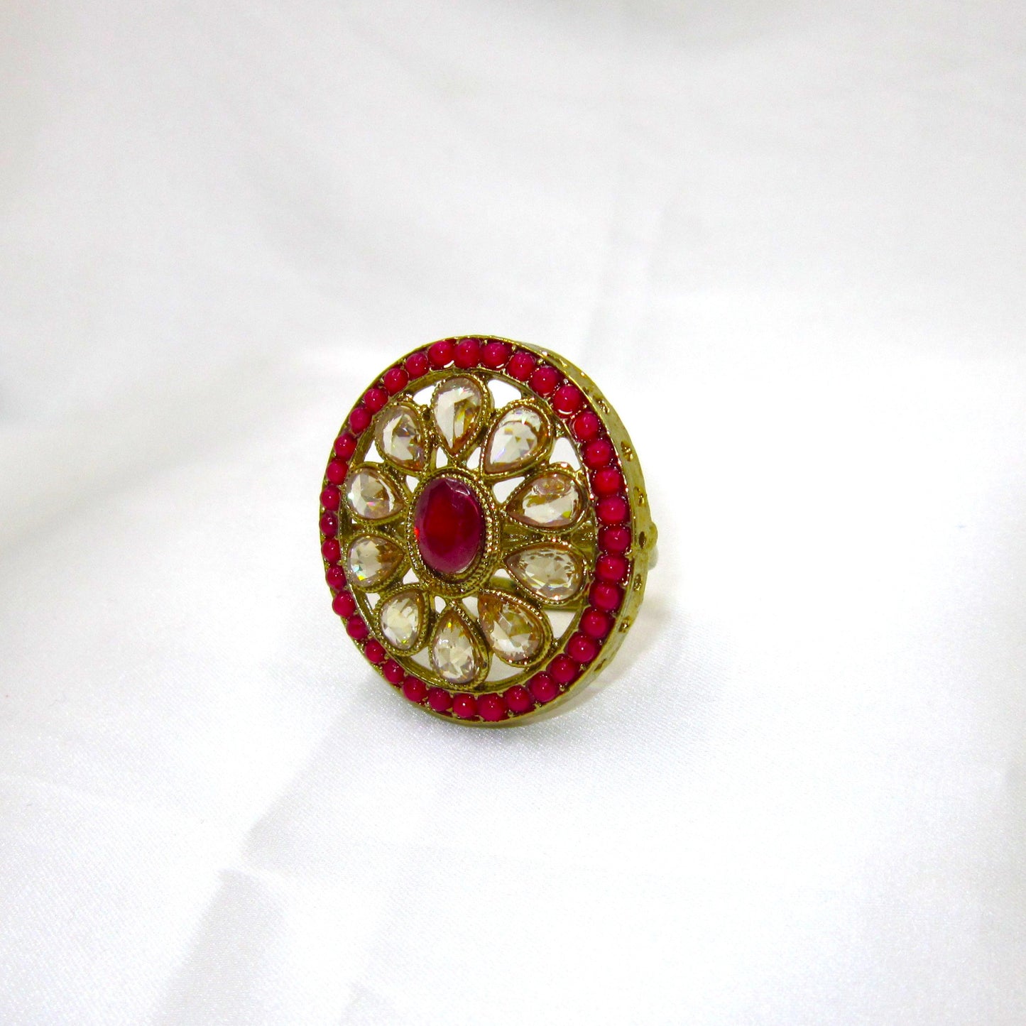 Gulmohar Heritage Ruby Pink Antique Finish Ring by Enava featuring white uncut Polki-style stones, ruby pink centre stone, antique gold finish, adjustable ethnic statement ring for weddings, festive and traditional occasions.