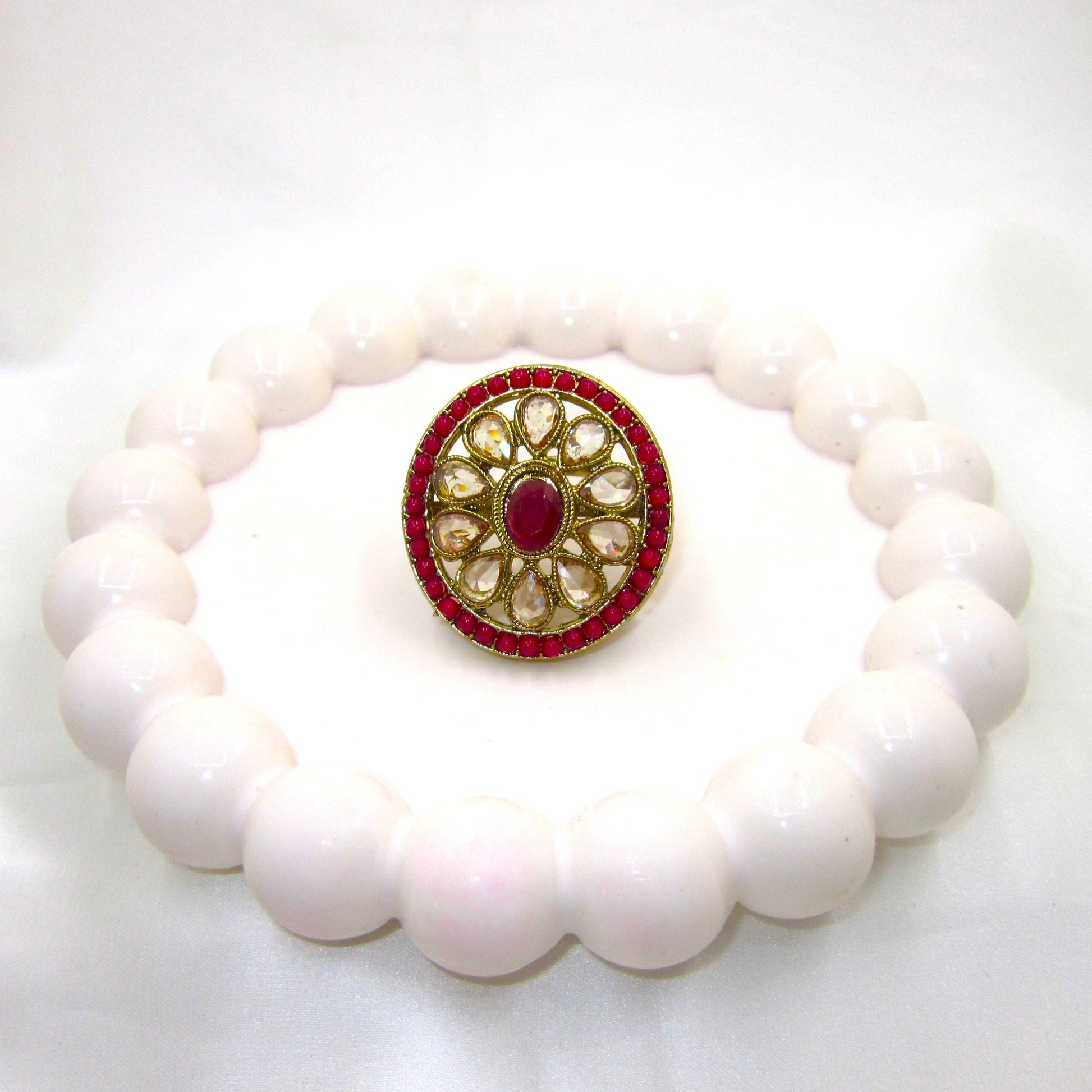 Gulmohar Heritage Ruby Pink Antique Finish Ring by Enava featuring white uncut Polki-style stones, ruby pink centre stone, antique gold finish, adjustable ethnic statement ring for weddings, festive and traditional occasions.