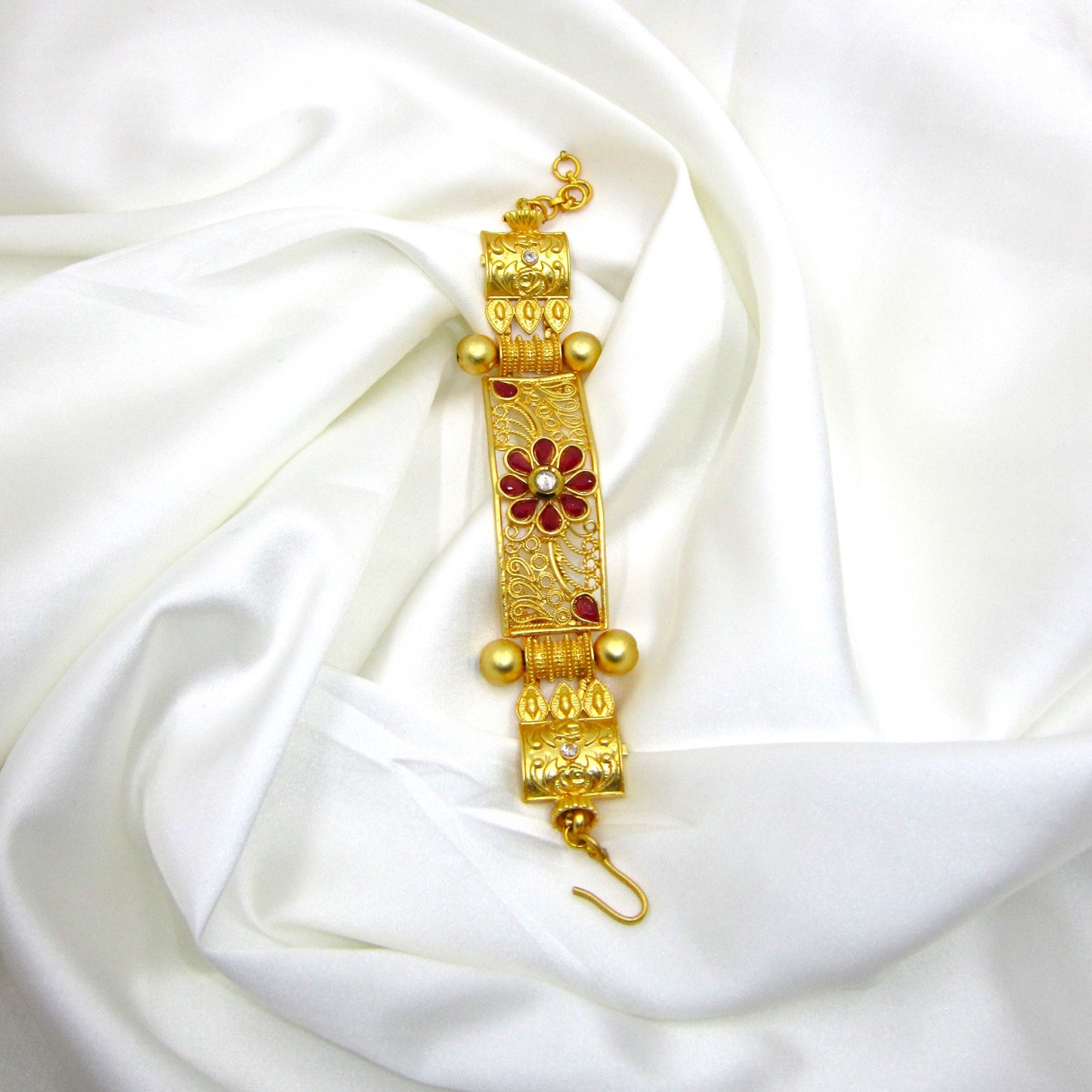 Premium Gulnaar Rajwadi Kada Bracelet by Enava with ruby red flower design, filigree patterns, antique gold finish, and handcrafted ethnic jewellery styling.