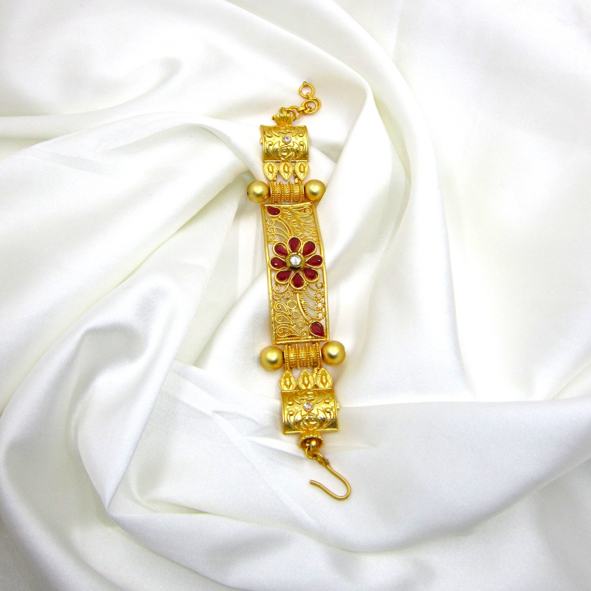 Premium Gulnaar Rajwadi Kada Bracelet by Enava with ruby red flower design, filigree patterns, antique gold finish, and handcrafted ethnic jewellery styling.