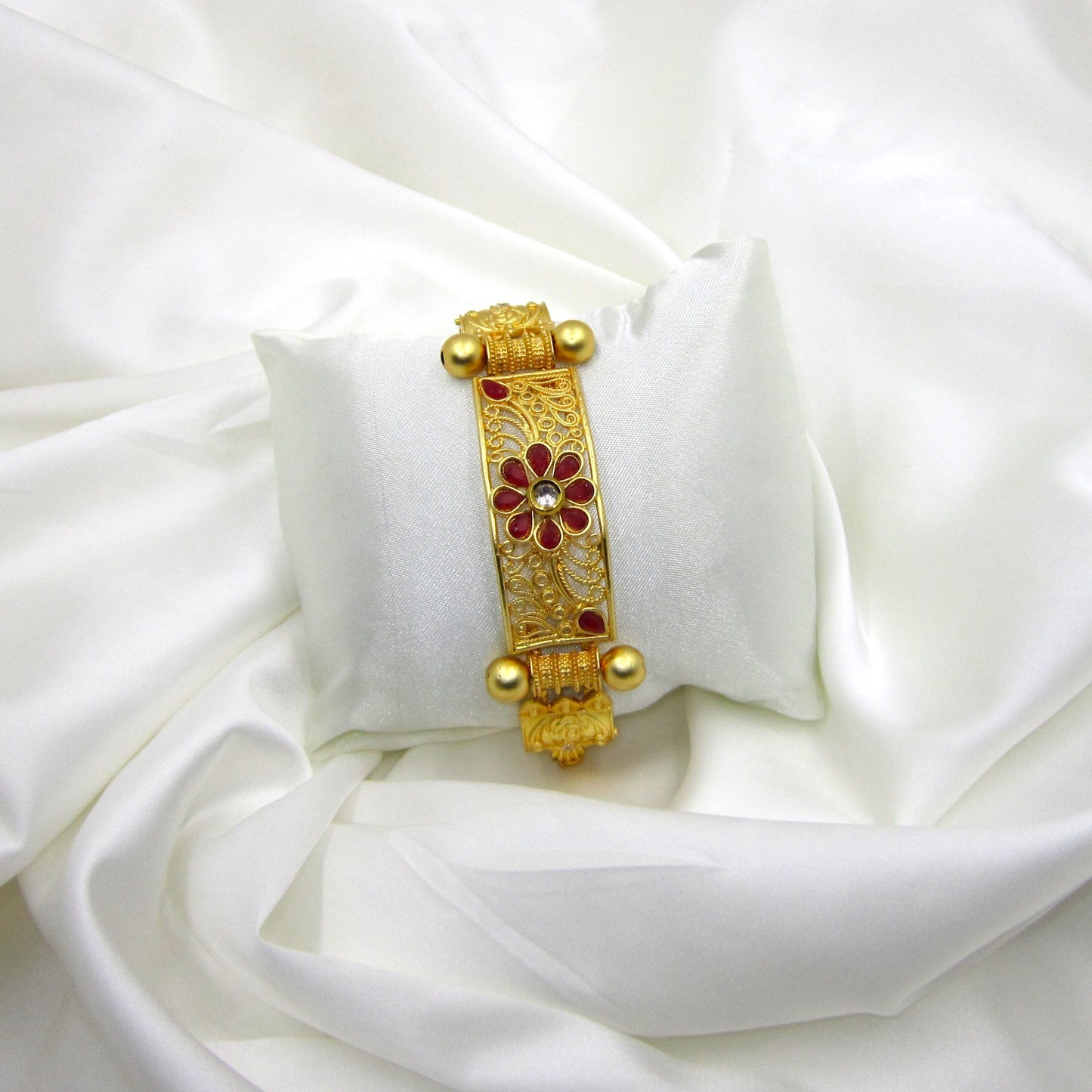 Premium Gulnaar Rajwadi Kada Bracelet by Enava with ruby red flower design, filigree patterns, antique gold finish, and handcrafted ethnic jewellery styling.