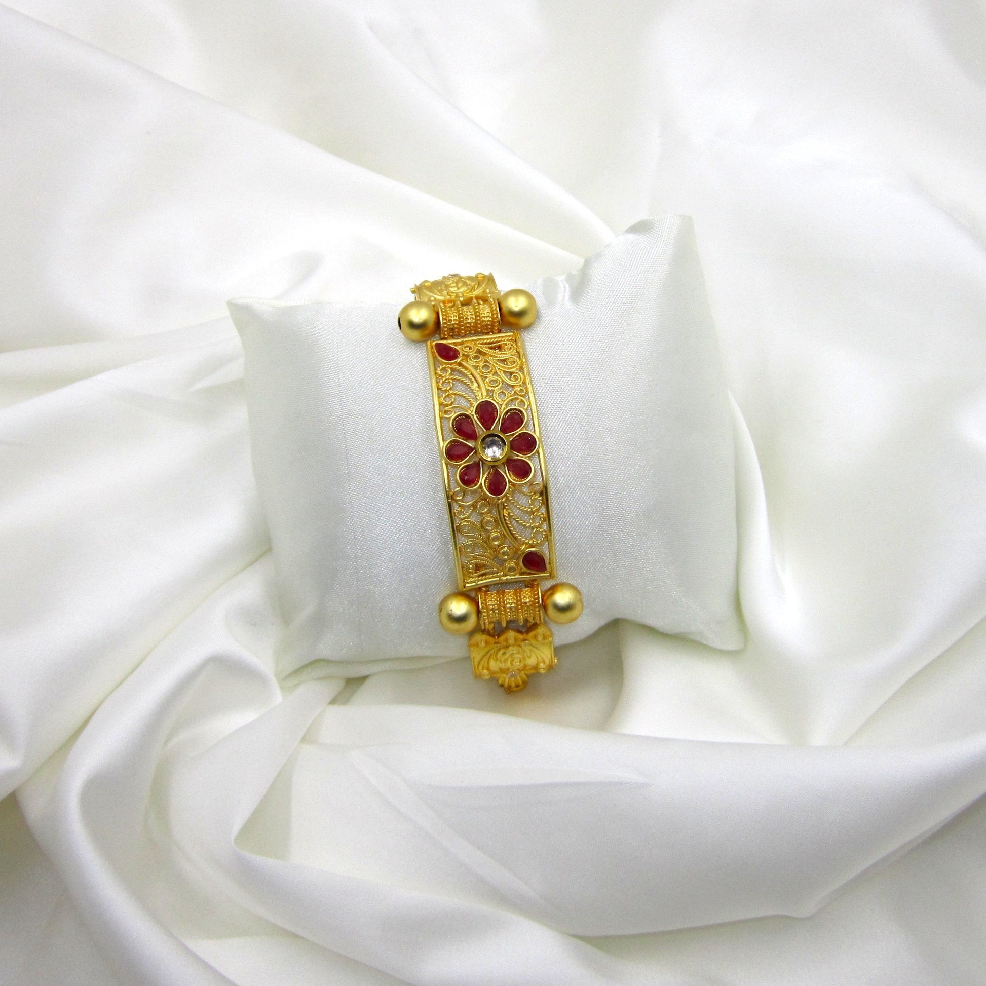 Premium Gulnaar Rajwadi Kada Bracelet by Enava with ruby red flower design, filigree patterns, antique gold finish, and handcrafted ethnic jewellery styling.