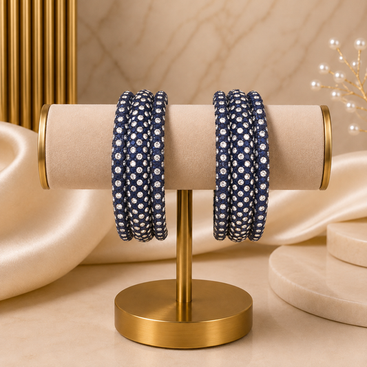 Meher Dark Blue Festive Bangle Set with 2 kada bangles and 4 side bangles featuring dark blue detailing, golden accents and sparkling stones by ENAVA