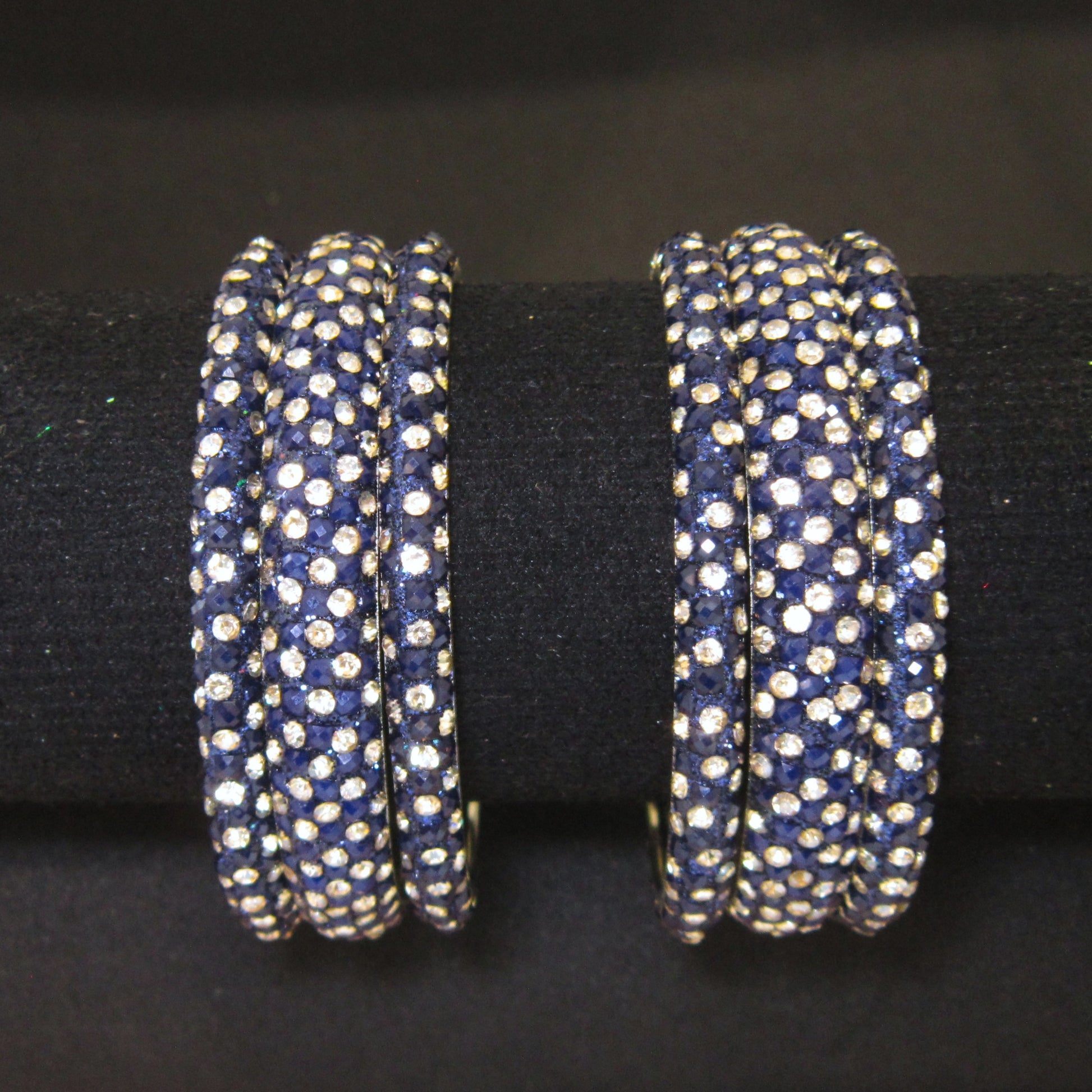 Meher Dark Blue Festive Bangle Set with 2 kada bangles and 4 side bangles featuring dark blue detailing, golden accents and sparkling stones by ENAVA