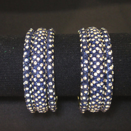 Meher Dark Blue Festive Bangle Set with 2 kada bangles and 4 side bangles featuring dark blue detailing, golden accents and sparkling stones by ENAVA