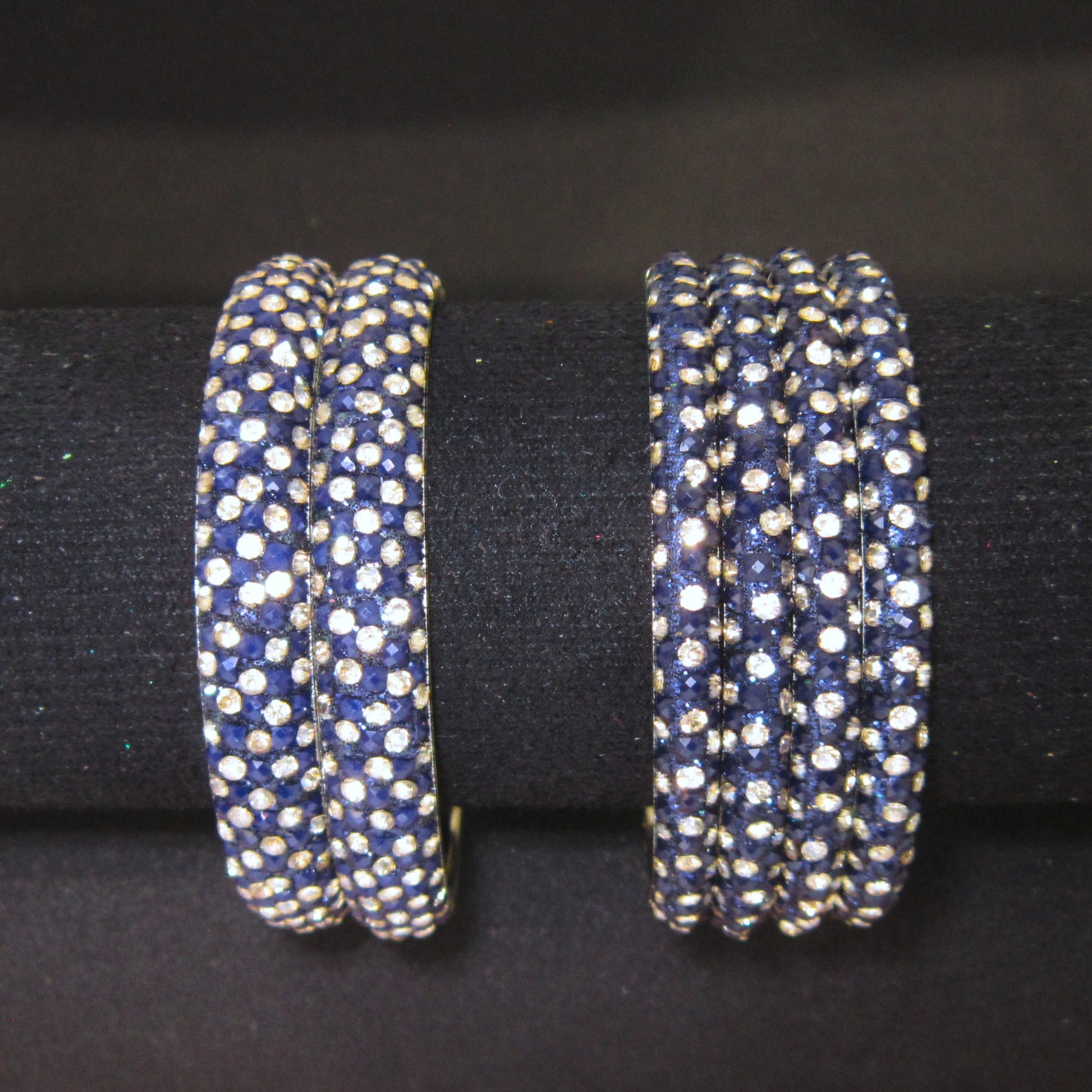 Meher Dark Blue Festive Bangle Set with 2 kada bangles and 4 side bangles featuring dark blue detailing, golden accents and sparkling stones by ENAVA