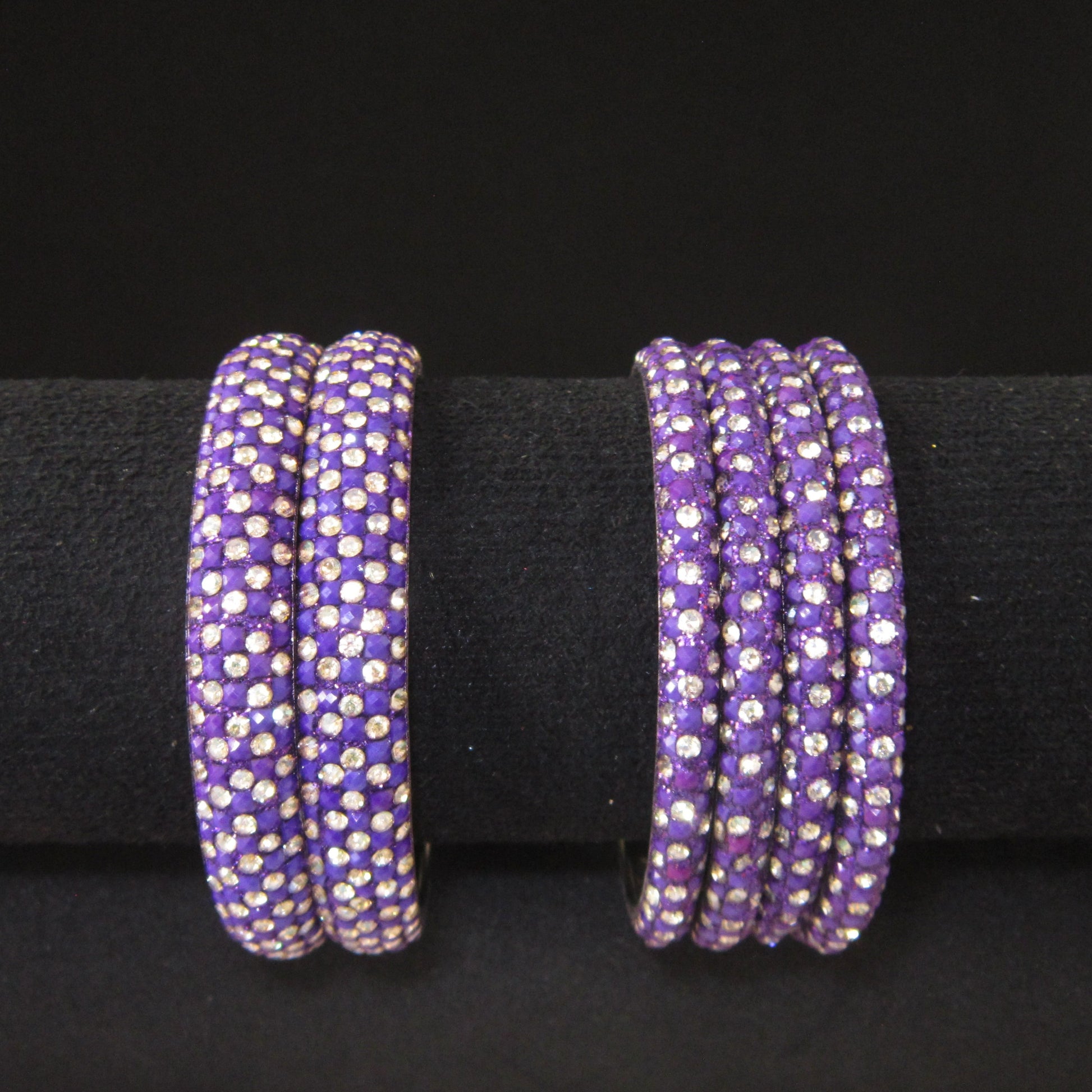 Meher Dark Purple Festive Bangle Set with 2 kada bangles and 4 side bangles featuring dark purple detailing, golden accents and sparkling stones by ENAVA