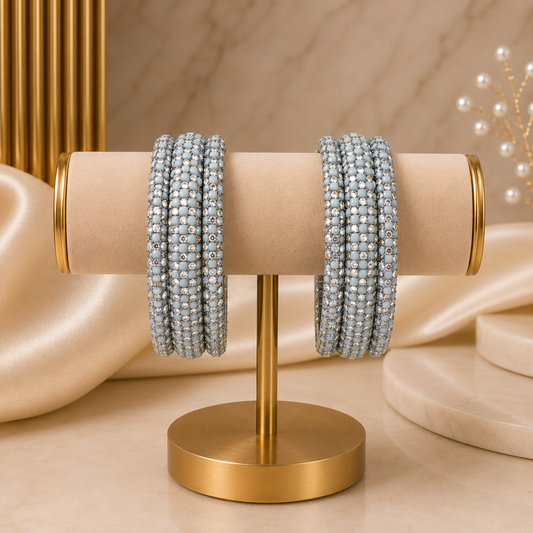 Meher Grey Festive Bangle Set with 2 kada bangles and 4 side bangles featuring grey detailing, golden accents and sparkling stones by ENAVA