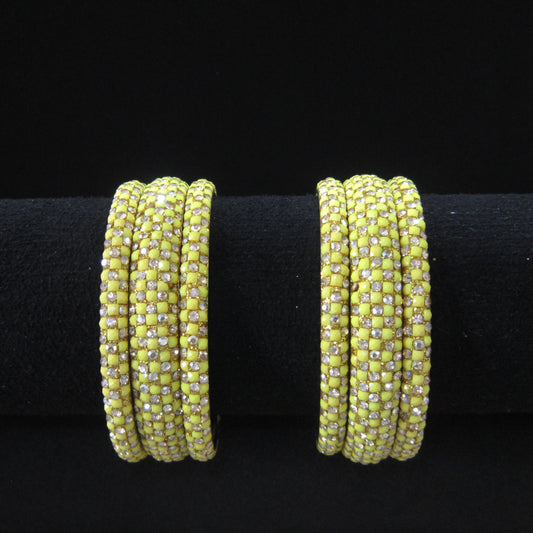 Meher Lemon Yellow Festive Bangle Set with 2 kada bangles and 4 side bangles featuring lemon yellow detailing, golden accents and sparkling stones by ENAVA