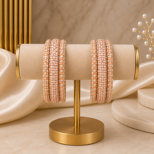 Meher Light Peach Festive Bangle Set with 2 kada bangles and 4 side bangles featuring light peach detailing, golden accents and sparkling stones by ENAVA