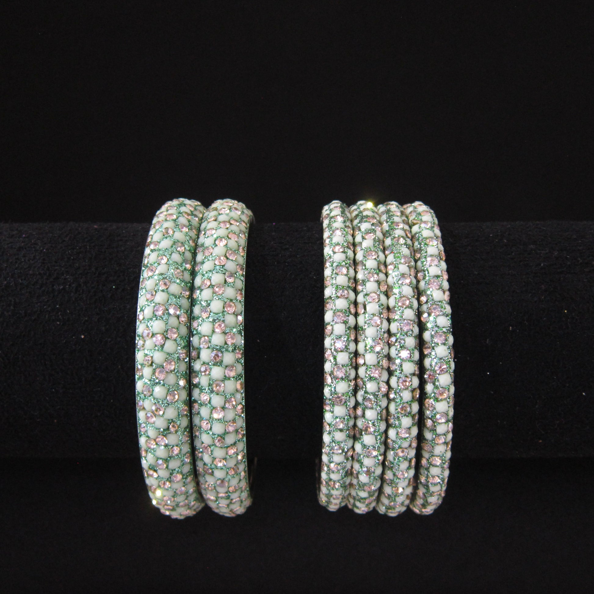 Meher Light Pista Festive Bangle Set with 2 kada bangles and 4 side bangles featuring light pista green detailing, golden accents and sparkling stones by ENAVA