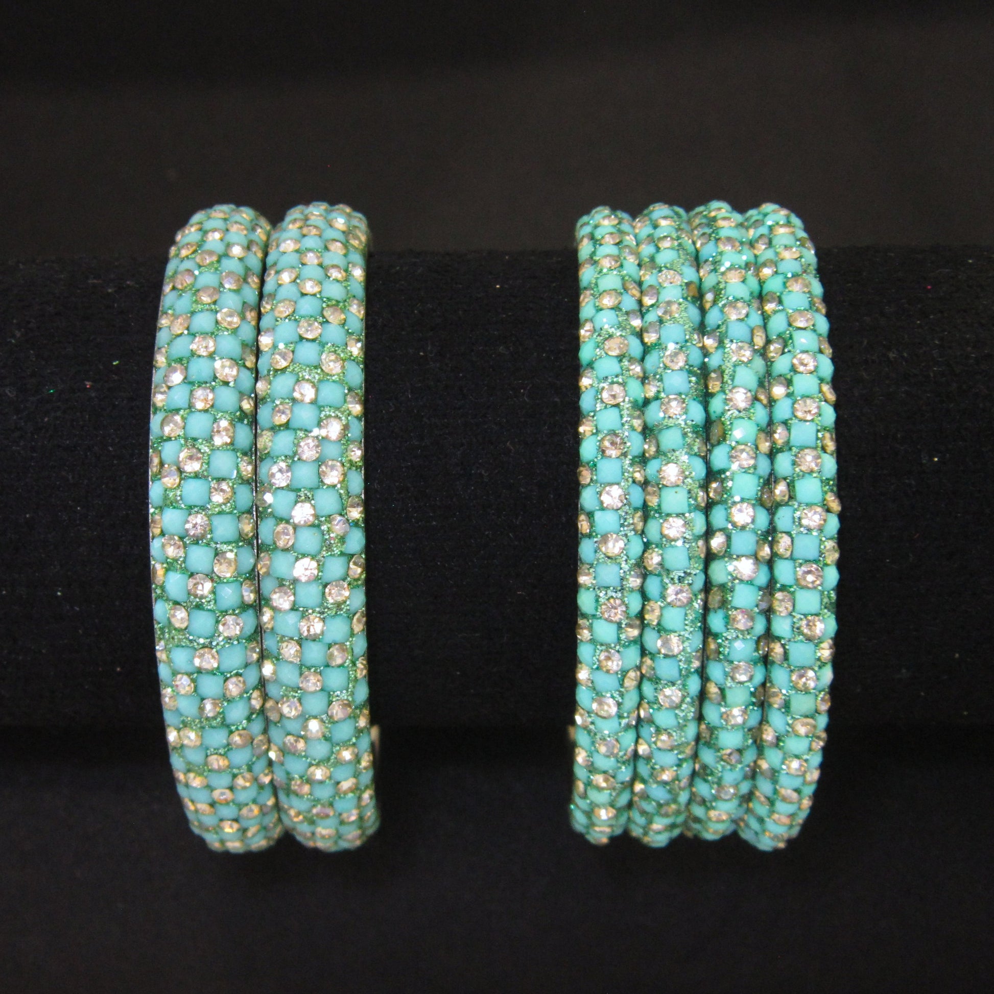 Meher Light Turquoise Festive Bangle Set with 2 kada bangles and 4 side bangles featuring light turquoise detailing, golden accents and sparkling stones by ENAVA