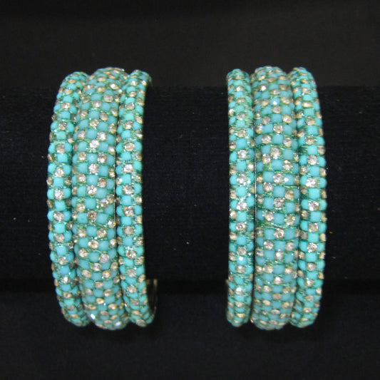 Meher Light Turquoise Festive Bangle Set with 2 kada bangles and 4 side bangles featuring light turquoise detailing, golden accents and sparkling stones by ENAVA