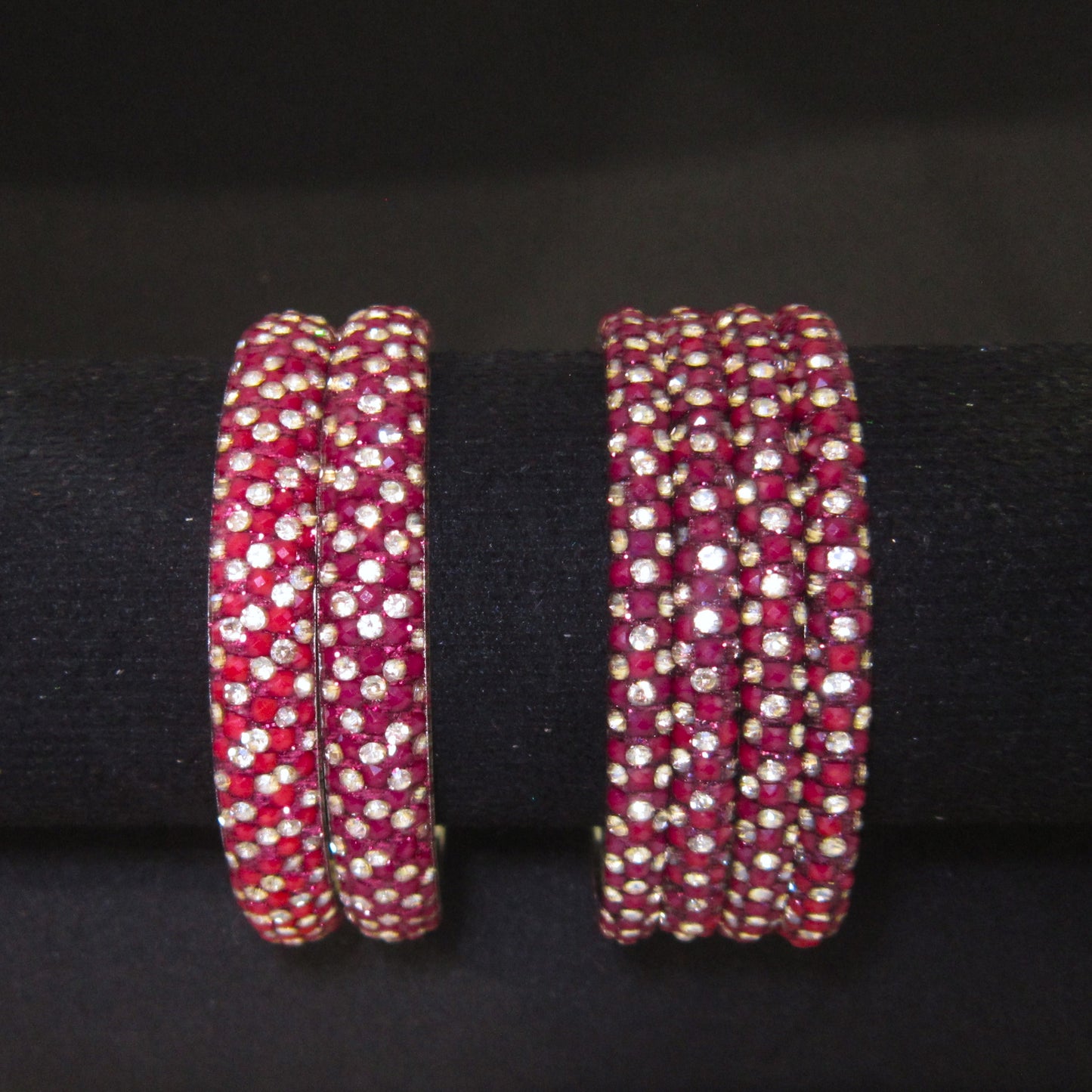 Meher Maroon Festive Bangle Set with 2 kada bangles and 4 side bangles featuring maroon detailing, golden accents and sparkling stones by ENAVA