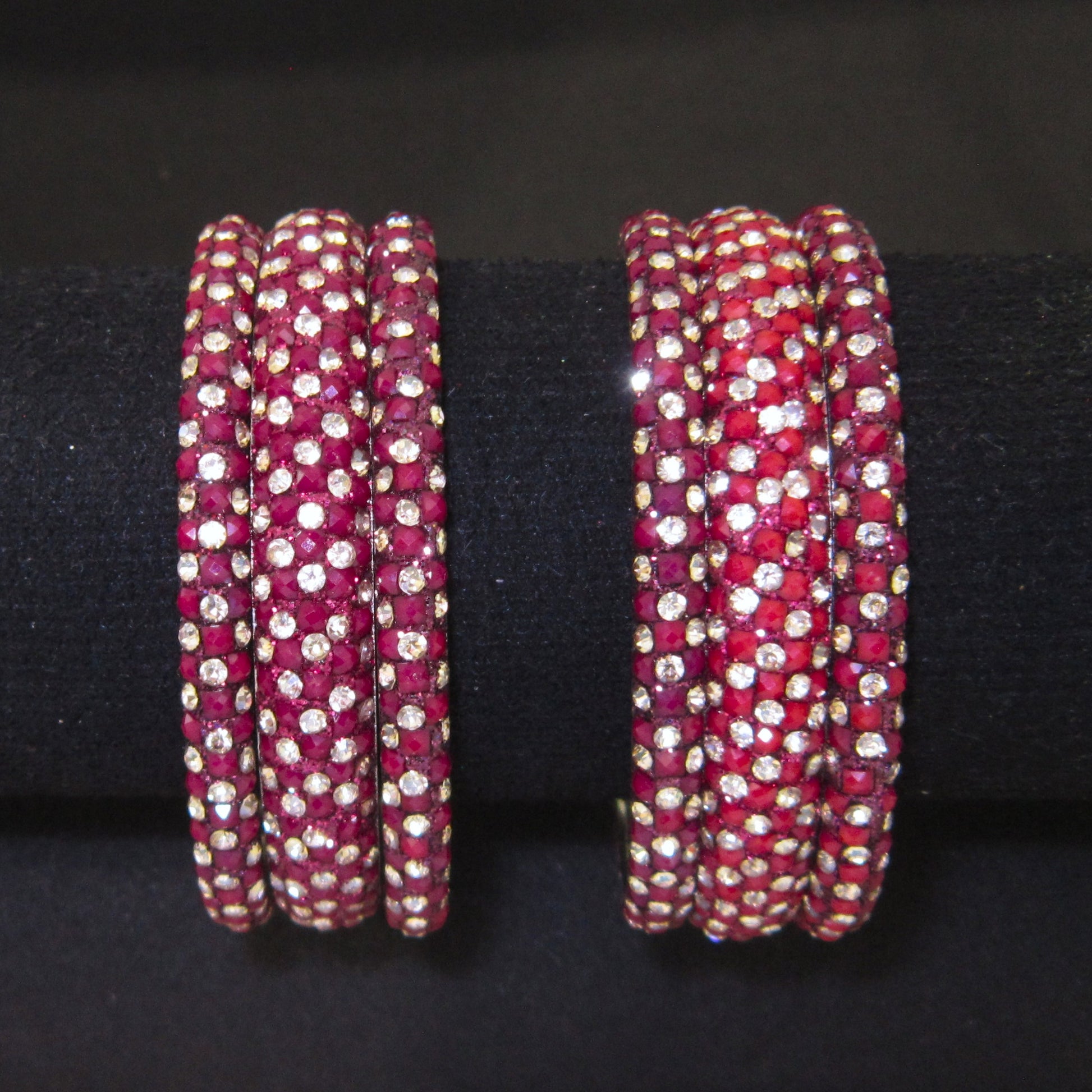 Meher Maroon Festive Bangle Set with 2 kada bangles and 4 side bangles featuring maroon detailing, golden accents and sparkling stones by ENAVA
