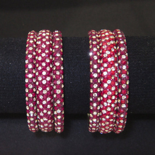 Meher Maroon Festive Bangle Set with 2 kada bangles and 4 side bangles featuring maroon detailing, golden accents and sparkling stones by ENAVA