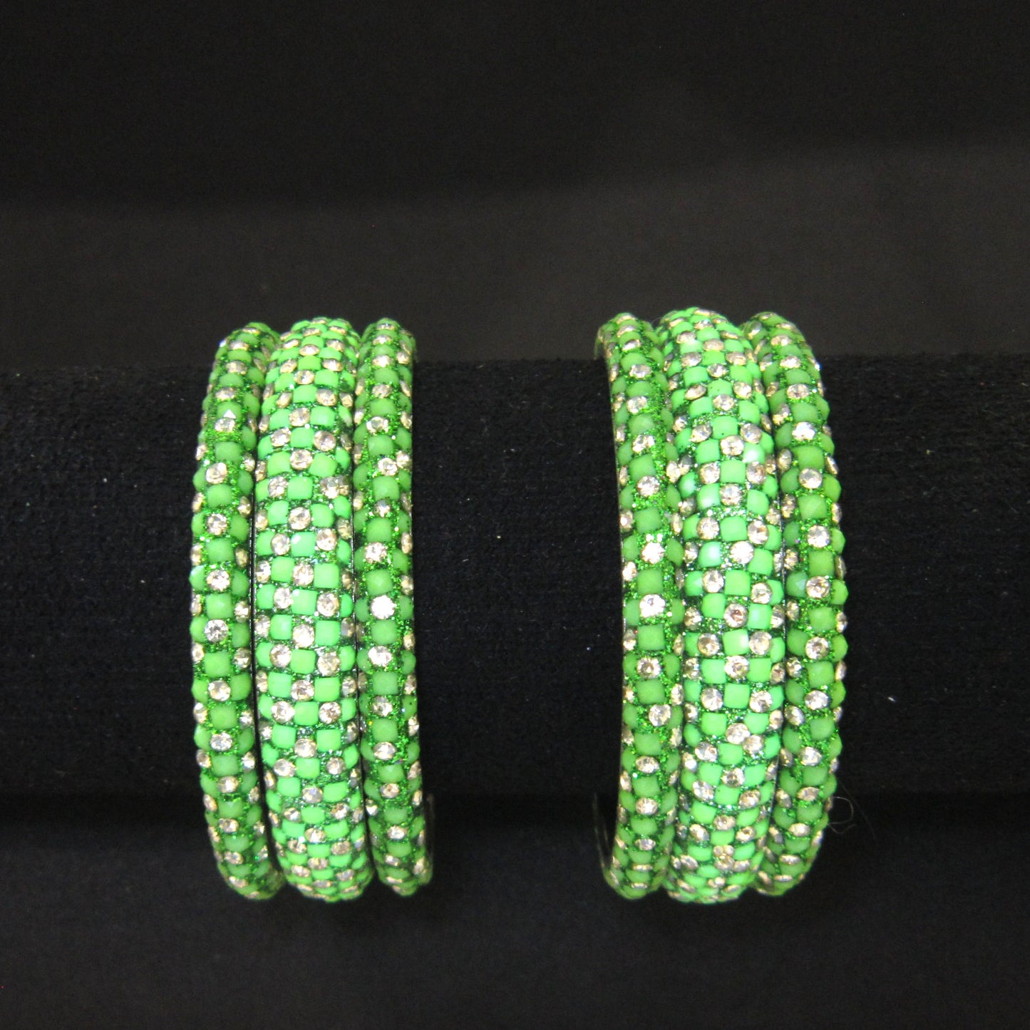 Meher Parrot Green Festive Bangle Set with 2 kada bangles and 4 side bangles featuring parrot green detailing, golden accents and sparkling stones by ENAVA