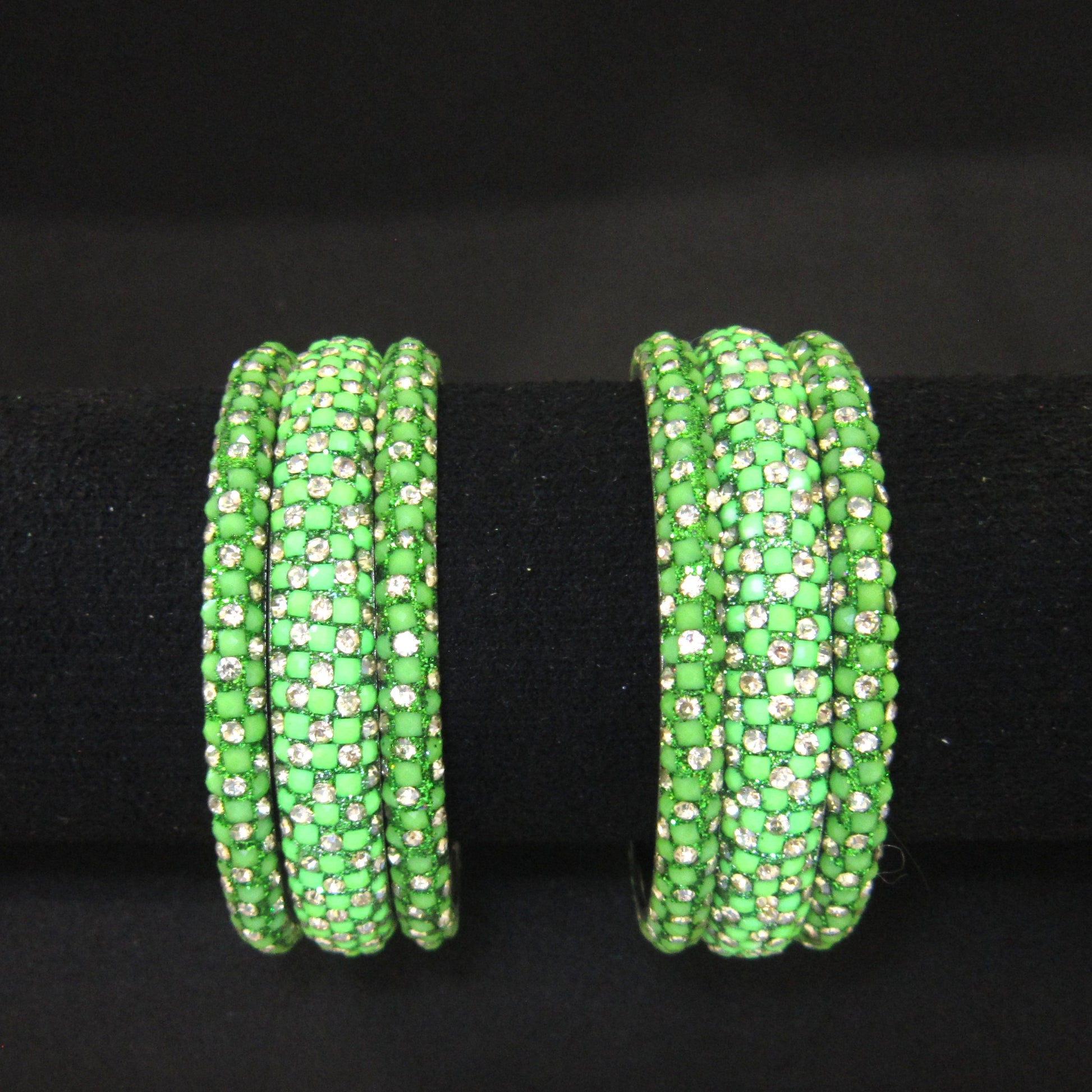 Meher Parrot Green Festive Bangle Set with 2 kada bangles and 4 side bangles featuring parrot green detailing, golden accents and sparkling stones by ENAVA