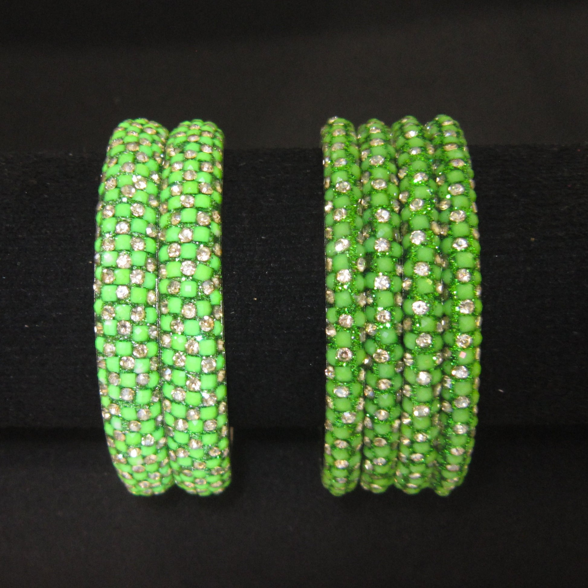 Meher Parrot Green Festive Bangle Set with 2 kada bangles and 4 side bangles featuring parrot green detailing, golden accents and sparkling stones by ENAVA