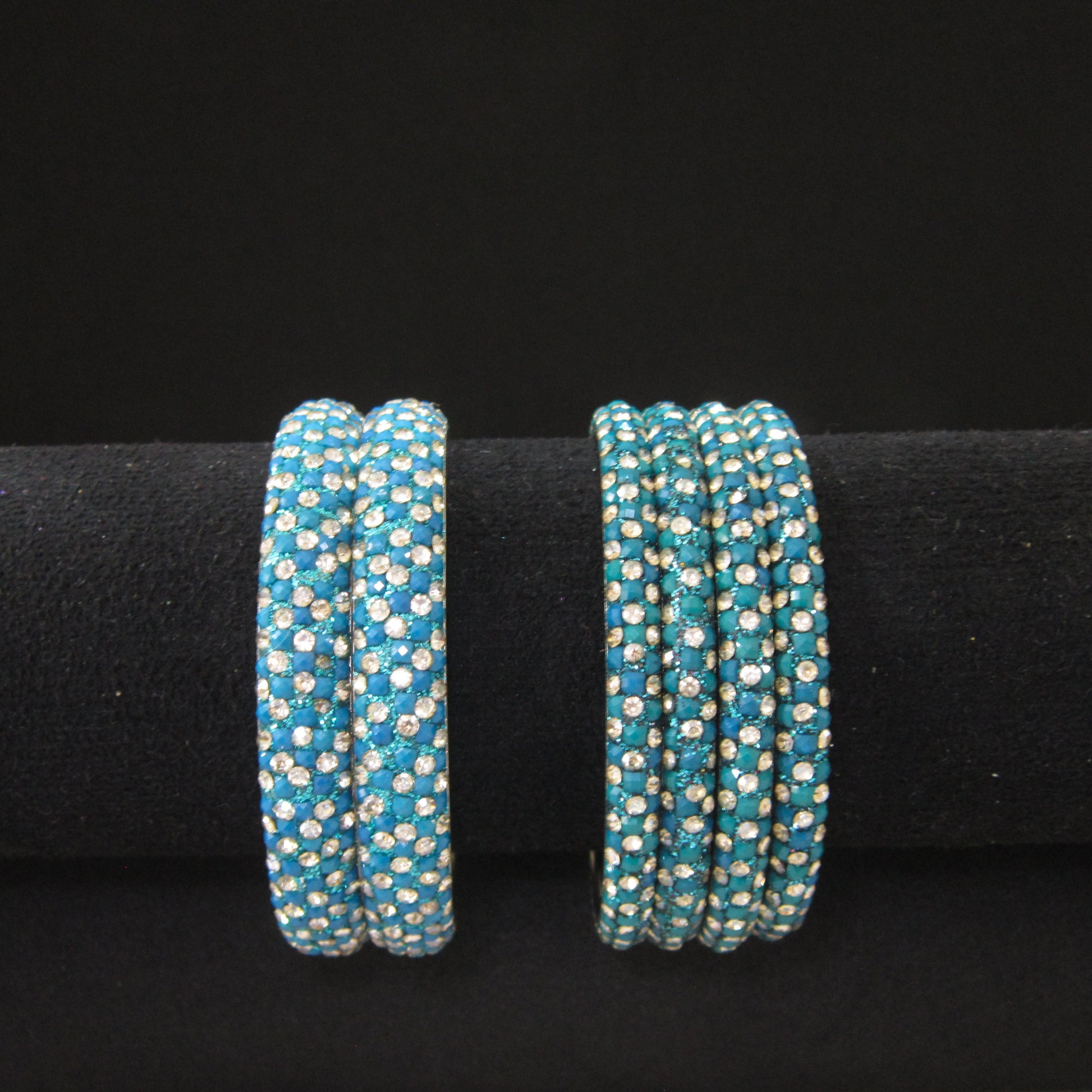 Meher Peacock Festive Bangle Set with 2 kada bangles and 4 side bangles featuring peacock green-blue detailing, golden accents and sparkling stones by ENAVA