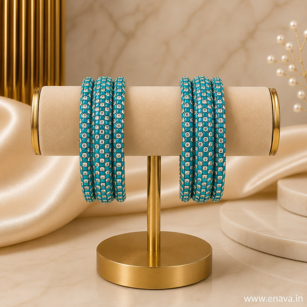 Two sets of turquoise blue beaded bangles with white geometric patterns, displayed on a gold stand against a beige marble background.