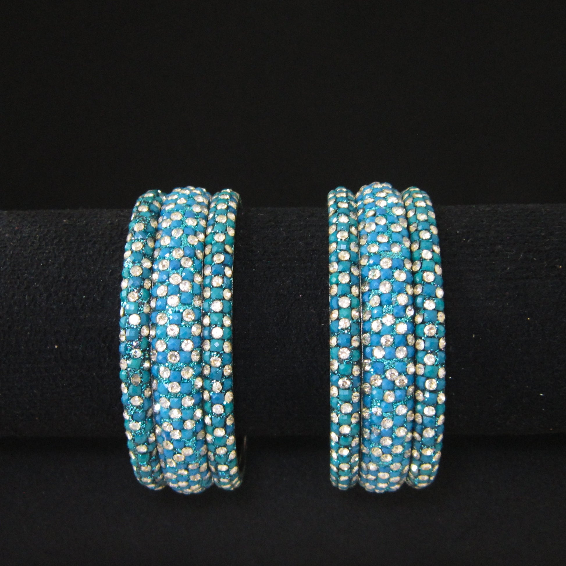 Meher Peacock Festive Bangle Set with 2 kada bangles and 4 side bangles featuring peacock green-blue detailing, golden accents and sparkling stones by ENAVA