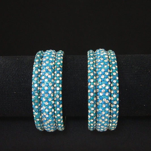 Meher Peacock Festive Bangle Set with 2 kada bangles and 4 side bangles featuring peacock green-blue detailing, golden accents and sparkling stones by ENAVA