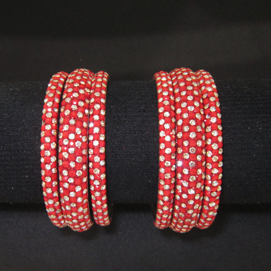 Meher Red Festive Bangle Set with 2 kada bangles and 4 side bangles featuring red detailing, golden accents and sparkling stones by ENAVA