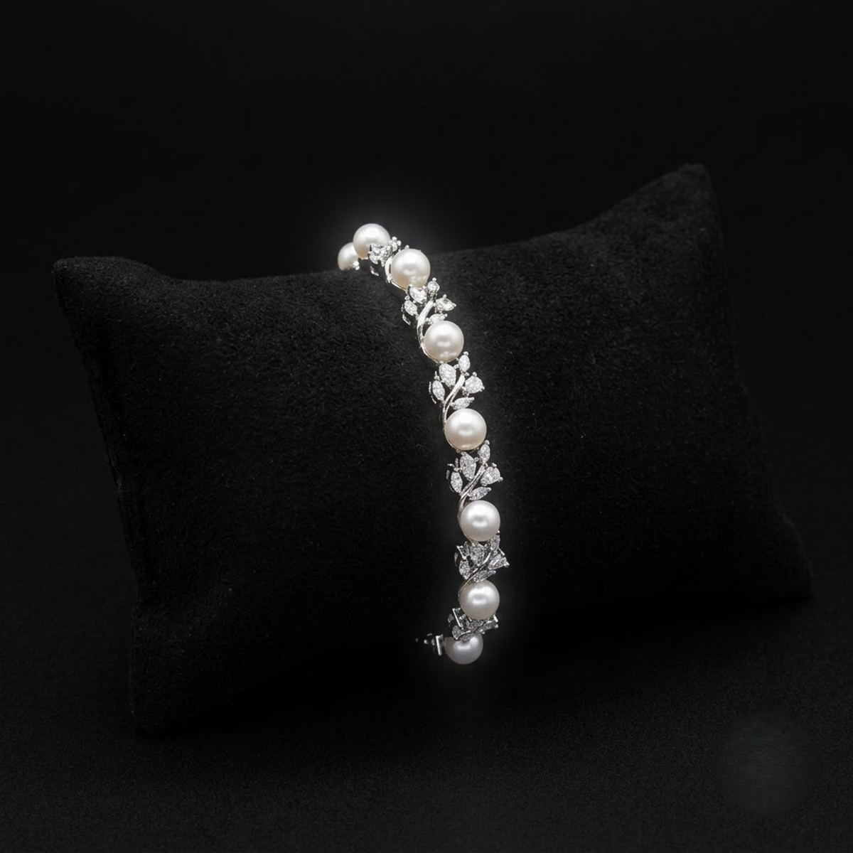 Onyxia Pearl Sparkling AD Bracelet with white pearls and leaf-inspired American Diamond AD stones, elegant designer pearl bracelet for women by ENAVA.