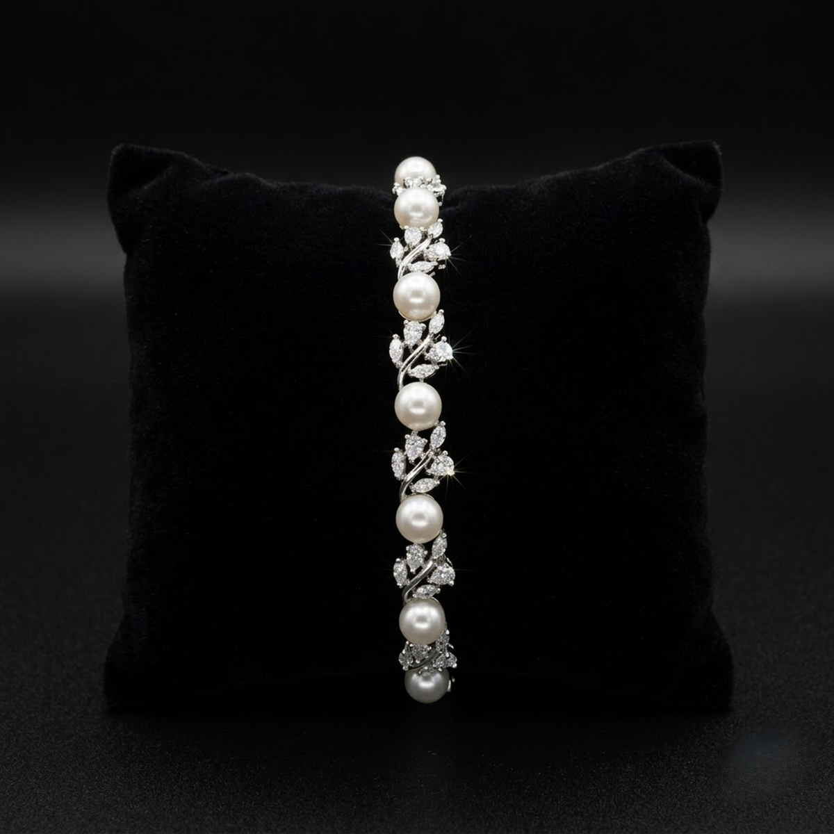 Onyxia Pearl Sparkling AD Bracelet with white pearls and leaf-inspired American Diamond AD stones, elegant designer pearl bracelet for women by ENAVA.