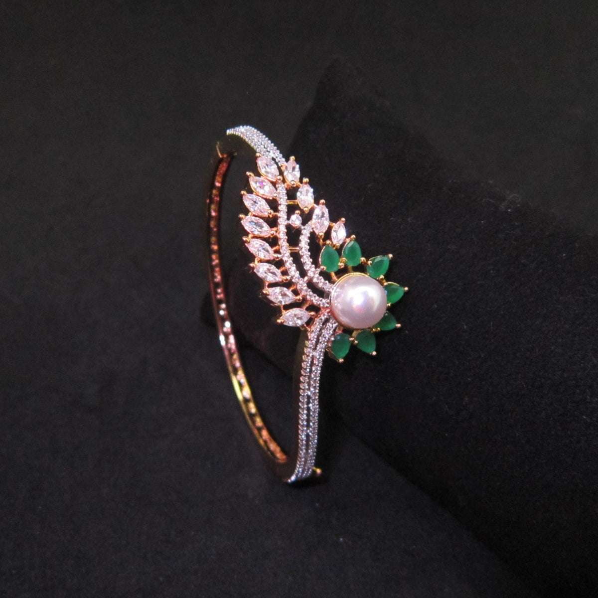 Pankhuri AD Green Emerald Bracelet with green emerald flower petal design, two-tone finish and sparkling American Diamond detailing, elegant designer bracelet for women by ENAVA.