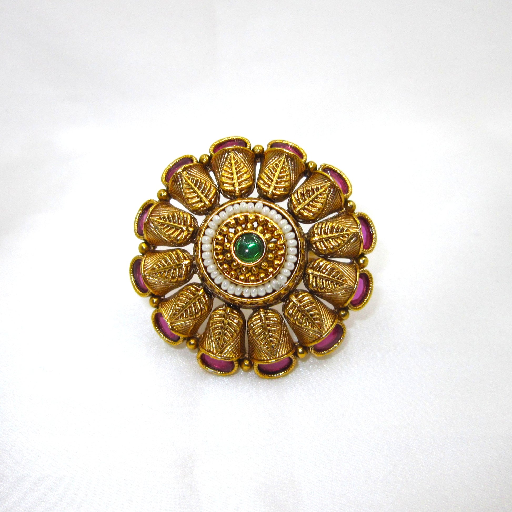 Pankhuri Pearl Heritage Ethnic Ring by Enava with engraved leaf petal design, ruby pink stones, pearl halo, green centre stone, antique gold plating, adjustable traditional statement ring for weddings and festive ethnic wear.