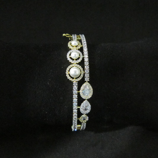 Pearl Oasis AD Bracelet with pearls, sparkling American Diamond stones and drop-shaped center AD in dual-tone finish, designer pearl bracelet for women by ENAVA.